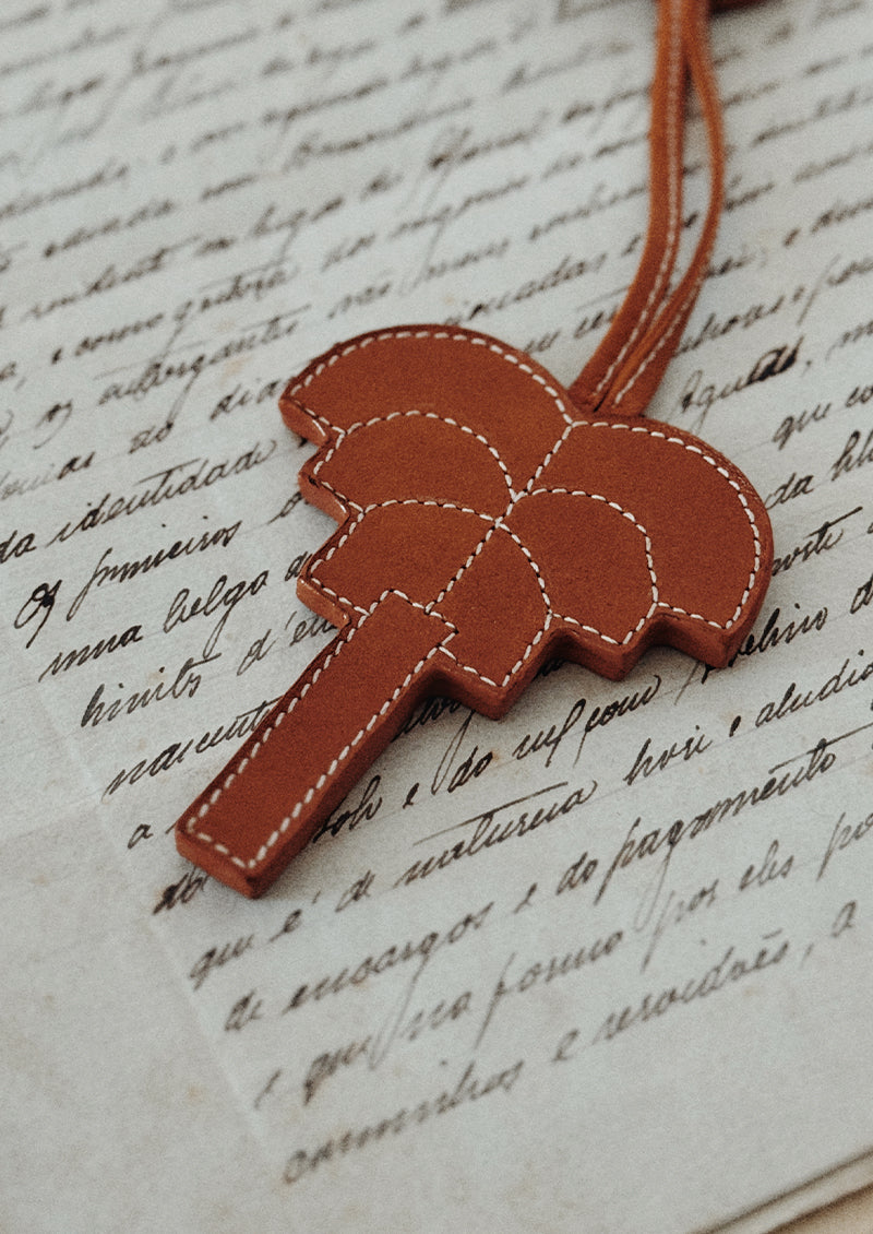 Signature palm leather charm