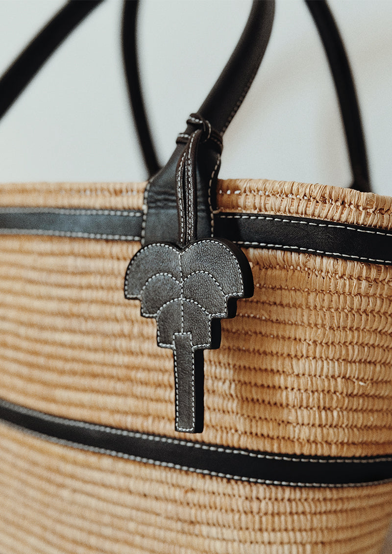 Signature palm leather charm