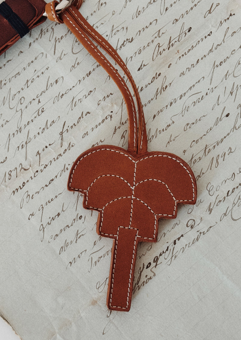 Signature palm leather charm